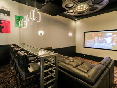 Home Theater With Comfortable Three Level Seating And Bar Seating